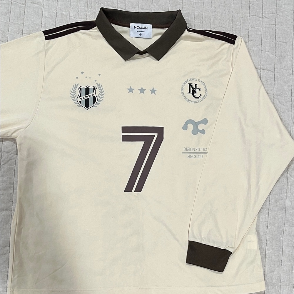 Cream Long Sleeve Jersey with dark brown collar. Size small brand Noycommon
